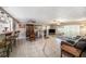 Open floor plan featuring tile floors, ceiling fans, and a dining area at 135 Rodney Ct, Palm Harbor, FL 34684