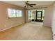 Bedroom featuring a sliding door to a screened patio at 1375 Doolittle Ln # 101, Dunedin, FL 34698