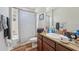 Bathroom with a shower and a granite vanity and sink at 14319 Rolling Dune Rd, Lithia, FL 33547