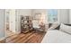 Bright bedroom featuring modern decor, an office desk and a window with blinds at 14319 Rolling Dune Rd, Lithia, FL 33547