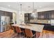 Gourmet kitchen with granite counters, stainless steel appliances, and pendant lighting at 14319 Rolling Dune Rd, Lithia, FL 33547