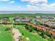 Picture of well manicured golf course and condominiums near the water at 14820 Rue De Bayonne # 208, Clearwater, FL 33762