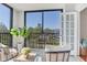 Serene balcony featuring outdoor seating, a potted plant, and a peaceful view at 14820 Rue De Bayonne # 208, Clearwater, FL 33762