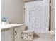 Full bathroom with a vanity and shower featuring decorative floral-patterned shower curtain at 14820 Rue De Bayonne # 208, Clearwater, FL 33762