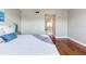 Bedroom boasts hardwood floors and a decorative blue-themed comforter set at 14820 Rue De Bayonne # 208, Clearwater, FL 33762