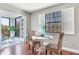 Cozy dining nook with a round table, wicker chairs, and natural light from the window at 14820 Rue De Bayonne # 208, Clearwater, FL 33762