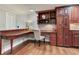 Stylish entryway with custom built-ins, wood floors and a convenient desk area at 14820 Rue De Bayonne # 208, Clearwater, FL 33762