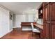 Charming entryway with wood floors, built-in desk, and ample storage space at 14820 Rue De Bayonne # 208, Clearwater, FL 33762