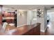 Inviting view of the kitchen area with wood cabinets, appliances and a convenient laundry room nearby at 14820 Rue De Bayonne # 208, Clearwater, FL 33762