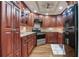 Beautiful kitchen featuring wood cabinets, stainless steel appliances, and an updated tile backsplash at 14820 Rue De Bayonne # 208, Clearwater, FL 33762
