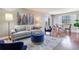 Inviting living room boasts hardwood floors, a comfortable sofa, and a tranquil atmosphere at 14820 Rue De Bayonne # 208, Clearwater, FL 33762