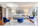 Open living area featuring hardwood floors, stylish decor, and an abundance of natural light at 14820 Rue De Bayonne # 208, Clearwater, FL 33762