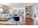 Bright living room featuring hardwood floors, stylish decor, and lots of natural light at 14820 Rue De Bayonne # 208, Clearwater, FL 33762
