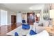 Well-designed living room offers hardwood floors, stylish furniture, and a welcoming atmosphere at 14820 Rue De Bayonne # 208, Clearwater, FL 33762