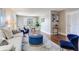 Comfortable living area with hardwood flooring, plush seating, and neutral color palette at 14820 Rue De Bayonne # 208, Clearwater, FL 33762