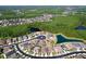 Aerial view of the community surrounded by ponds and a lush green landscape at 1723 Whitewillow Dr, Wesley Chapel, FL 33543