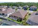 Aerial view of the property with a pergola, fenced-in yard, and mature landscaping at 1723 Whitewillow Dr, Wesley Chapel, FL 33543