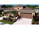 Stunning home with a three-car garage, beautiful landscaping, and a pristine driveway at 1723 Whitewillow Dr, Wesley Chapel, FL 33543