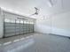 A spacious two-car garage with epoxy flooring at 1723 Whitewillow Dr, Wesley Chapel, FL 33543