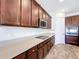 Beautiful kitchen featuring dark cabinetry, stainless steel appliances, and ample counter space for cooking at 1723 Whitewillow Dr, Wesley Chapel, FL 33543