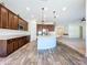 Spacious kitchen with a large island and dark cabinets at 1723 Whitewillow Dr, Wesley Chapel, FL 33543
