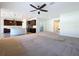 Open concept living space with kitchen and living room at 1723 Whitewillow Dr, Wesley Chapel, FL 33543
