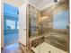 Walk-in shower with tile and bench at 1723 Whitewillow Dr, Wesley Chapel, FL 33543