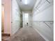 Large walk-in closet with wire shelving on both sides, leading to a bathroom area at 1723 Whitewillow Dr, Wesley Chapel, FL 33543