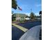 View of the Fountain Square Condominium entrance sign with mature palm trees and well kept landscaping at 1799 N Highland Ave # 170, Clearwater, FL 33755