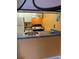 Charming kitchen design with a breakfast bar, white appliances, and pops of color at 1799 N Highland Ave # 170, Clearwater, FL 33755