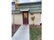 Exterior view of the community laundry room with clear signage and easy access at 1799 N Highland Ave # 170, Clearwater, FL 33755