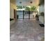Pool entrance through brick patio and decorative fencing at 1799 N Highland Ave # 170, Clearwater, FL 33755