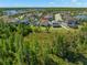 Aerial view showcasing a home with a spacious backyard in a lakeside community at 19487 Roseate Dr, Lutz, FL 33558