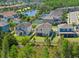 An aerial view of homes in a community near a lake at 19487 Roseate Dr, Lutz, FL 33558