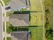 Aerial view of home featuring a well-maintained lawn and fenced backyard at 19487 Roseate Dr, Lutz, FL 33558