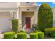The front door and front landscape of a two-story home at 19487 Roseate Dr, Lutz, FL 33558