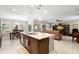 Open-concept kitchen with a large island that connects to the dining and living areas, creating a seamless flow at 19487 Roseate Dr, Lutz, FL 33558