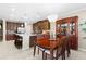 Kitchen and dining area featuring elegant furniture, chandeliers, and modern appliances, perfect for entertaining at 19487 Roseate Dr, Lutz, FL 33558