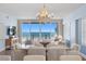 Inviting dining area featuring ocean views and a decorative chandelier at 19600 Gulf Blvd # 102, Indian Shores, FL 33785