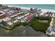 Amazing aerial view highlighting this condo's beach and bay access, plus community pool at 19727 Gulf Blvd # 210, Indian Shores, FL 33785