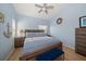 Bedroom featuring nautical themed decor, a ceiling fan, and light hardwood flooring at 19727 Gulf Blvd # 210, Indian Shores, FL 33785