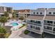 Charming coastal home with balconies overlooking a private pool and well-manicured landscaping at 19727 Gulf Blvd # 210, Indian Shores, FL 33785