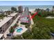 Coastal home with a private pool, balconies, and lush surroundings, ideally located near the beach at 19727 Gulf Blvd # 210, Indian Shores, FL 33785