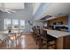 Modern kitchen featuring an island with seating, stainless steel appliances, and stylish finishes at 19727 Gulf Blvd # 210, Indian Shores, FL 33785
