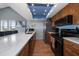 Beautiful kitchen boasts wooden cabinets, stainless appliances, and sleek countertops and breakfast bar at 19727 Gulf Blvd # 210, Indian Shores, FL 33785