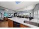 Open concept kitchen features a large breakfast bar, perfect for entertaining, and flows into living space at 19727 Gulf Blvd # 210, Indian Shores, FL 33785