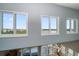 A beautiful view of the neighborhood and the water from the large windows in the living room at 19727 Gulf Blvd # 210, Indian Shores, FL 33785