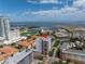 Aerial view of a city apartment building near a marina, with harbor and airport views at 199 Dali Blvd # 902, St Petersburg, FL 33701