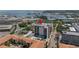 Aerial view of condo complex with a rooftop pool and marina nearby at 199 Dali Blvd # 902, St Petersburg, FL 33701