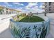 Unique art installation in a green space with landscaping and murals, enhancing the community's aesthetic appeal at 199 Dali Blvd # 902, St Petersburg, FL 33701